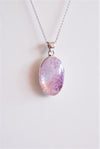 Colgante ovalado de piedra luna rosa en plata de ley