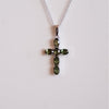Colgante cruz facetada de moldavita en plata